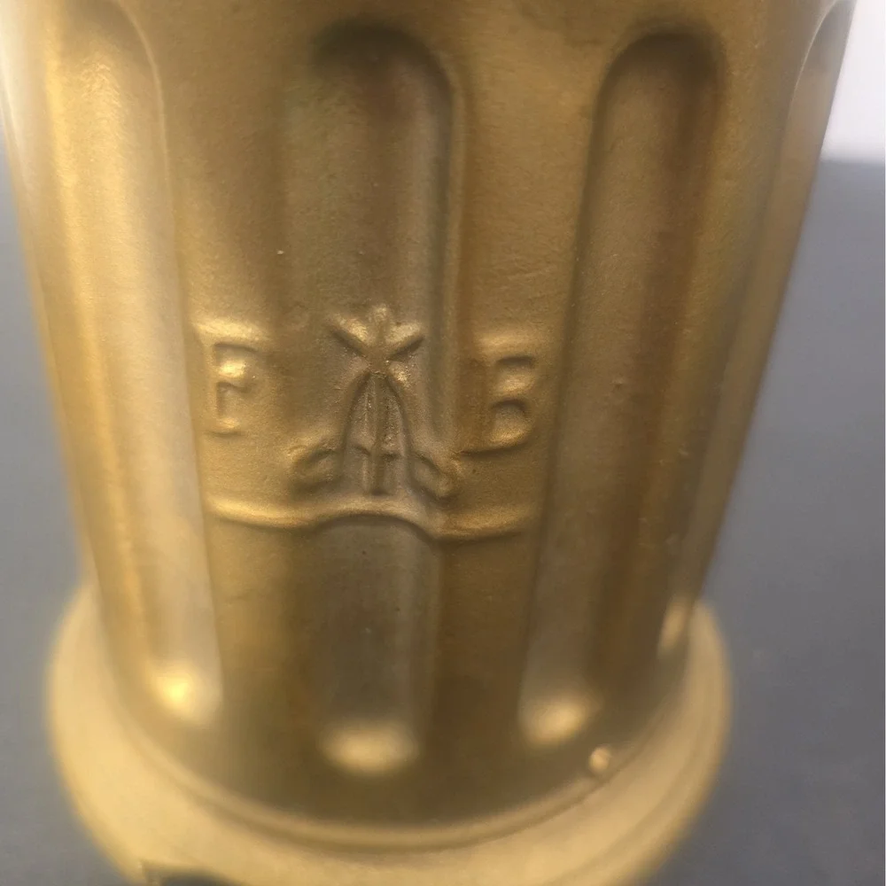 Antique F&B Tre Spade hand-crank coffee grinder with embossed three-spade logo.